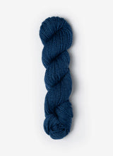 Blue Sky Fibers Baby Alpaca Sport Weight Melange yarn in soft, multicolored alpaca fiber, showcasing the textured yarn on a white background.