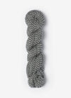 Blue Sky Fibers Baby Alpaca Sport Weight Melange alpaca yarn in soft blue and cream tones, showcasing the textured yarn strands.