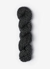 Blue Sky Fibers Baby Alpaca Sport Weight Melange alpaca yarn skein in soft blue and gray tones with label visible.