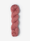 Blue Sky Fibers Baby Alpaca Sport Weight Melange yarn in soft, colorful alpaca fiber, showcasing a textured yarn skein.
