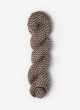 Blue Sky Fibers Baby Alpaca Sport Weight Melange alpaca yarn in soft blue and gray tones, showcasing the textured fiber twist.