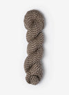 Blue Sky Fibers Baby Alpaca Sport Weight Melange alpaca yarn in soft blue and gray tones, showcasing the textured fiber twist.