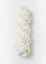 Blue Sky Fibers Sweater Worsted Superwash knitting yarn in a soft blue color, showing a close-up of the wool and cotton blend fiber strands.