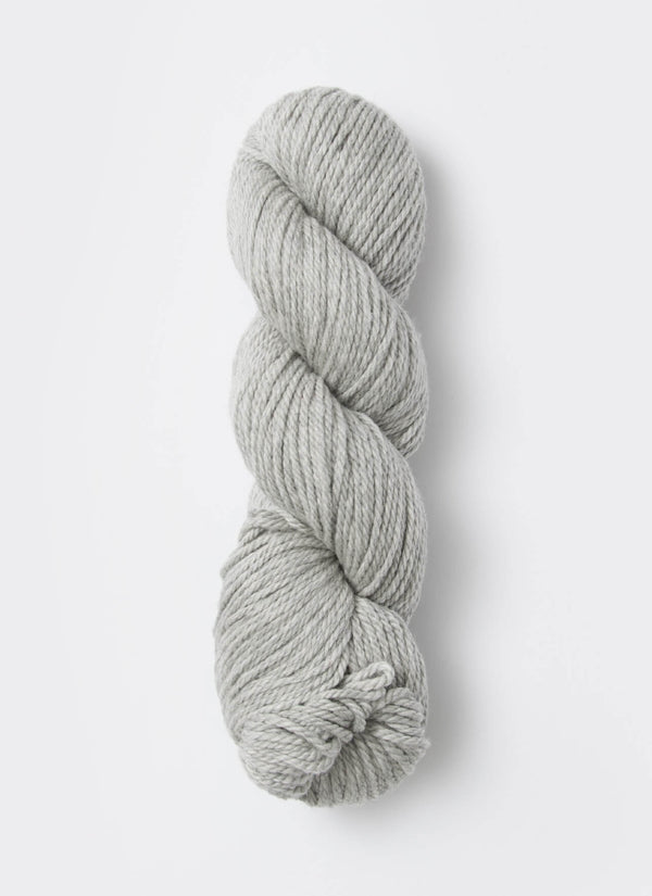 Blue Sky Fibers Sweater Worsted Superwash knitting yarn in blue, showcasing its soft wool and cotton blend for cozy projects.