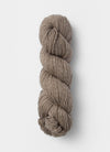 Blue Sky Fibers Sweater Worsted Superwash knitting yarn in blue, showing the soft, smooth wool and cotton blend fibers.