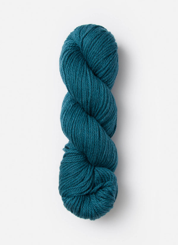 Blue Sky Fibers Sweater Worsted Superwash knitting yarn in soft blue, featuring a close-up of the wool and cotton blend fibers.