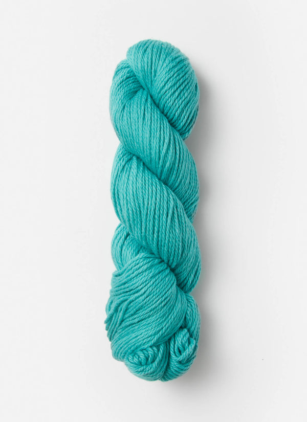 Blue Sky Fibers Sweater Worsted Superwash knitting yarn in soft wool and cotton blend, shown in a skein with vibrant blue color.