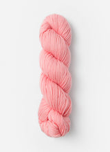 Blue Sky Fibers Sweater Worsted Superwash knitting yarn in soft blue color, showcasing smooth wool and cotton blend fibers.