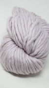 Cascade Yarns Magnum bulky yarn in orchid color, showing thick, soft yarn skein with vibrant purple hue.