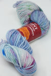 Cream-colored Jade Sapphire Zageo 6 Ply Cashmere yarn with floral pattern on white base, soft and luxurious textile.