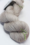 Close-up of madelinetosh Vintage merino wool yarn in antique lace color, showcasing its soft texture and rich hue.