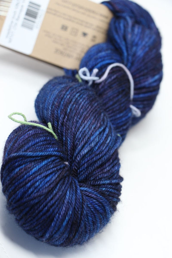 Madeline Tosh Vintage Merino Wool Yarn in Baroque Violet, showing the rich purple color and soft texture of the yarn skein.