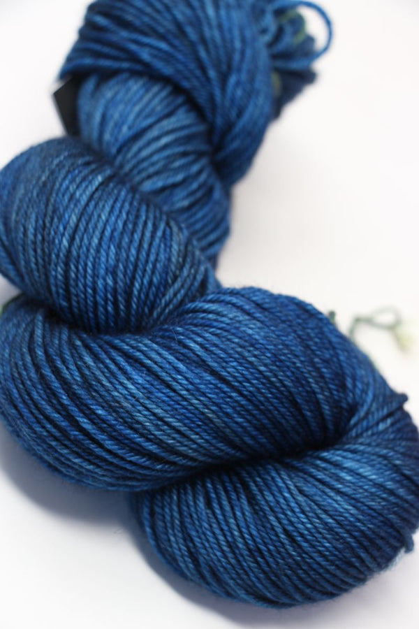 MadelineTosh Vintage Merino Wool Yarn in deep color, showing soft, textured yarn skein for knitting or crochet projects.