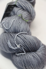 Madeline Tosh vintage merino wool yarn in great grey owl color, showcasing soft, textured yarn suitable for knitting or crochet projects.