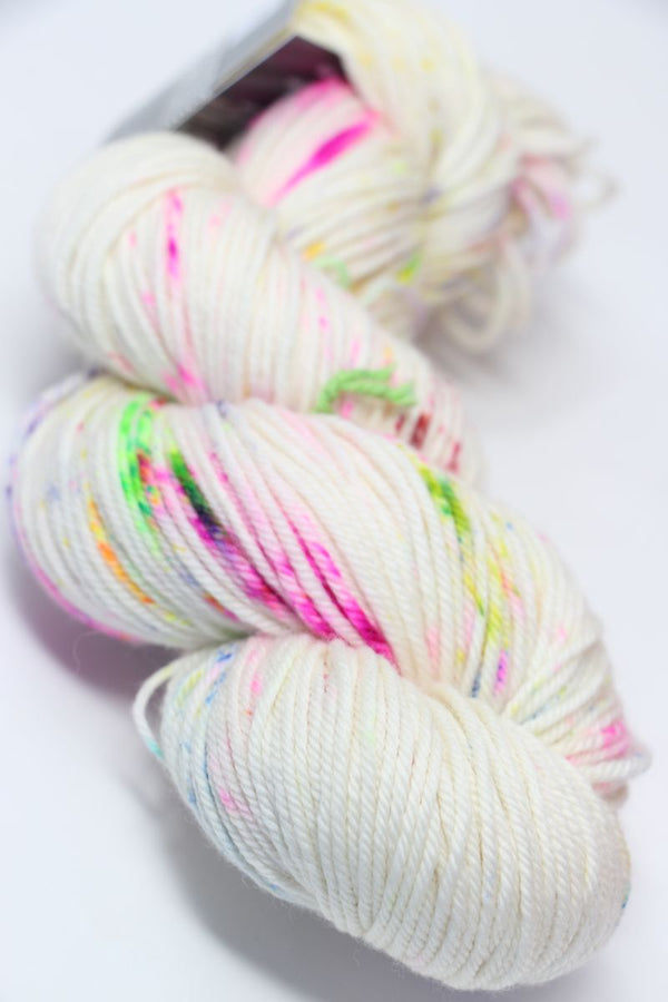 Madeline Tosh Vintage Merino Wool Yarn in festive colors, showcasing soft, high-quality yarn for knitting or crocheting projects.