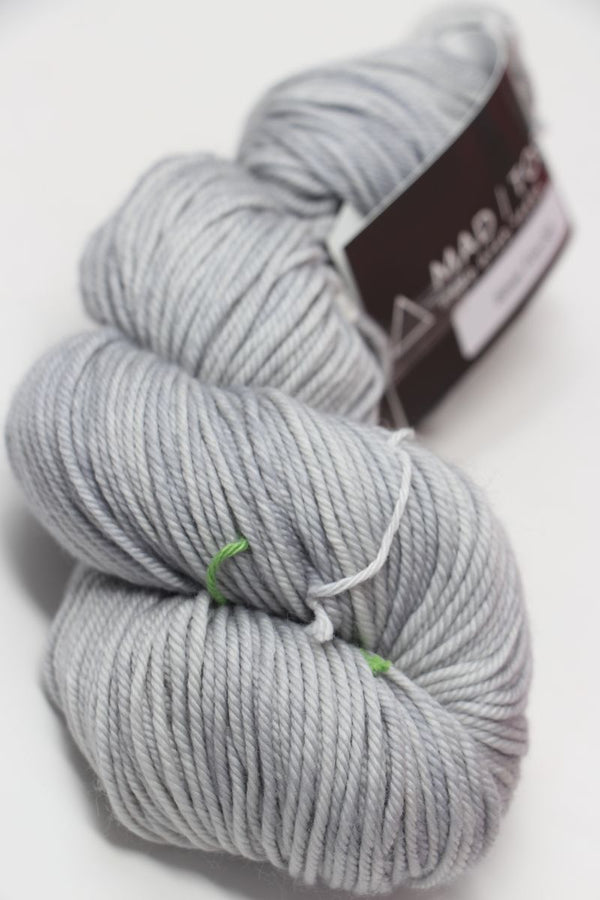 MadelineTosh Vintage Merino Wool Yarn in Silver Fox color, showcasing soft, textured yarn for knitting or crochet projects.