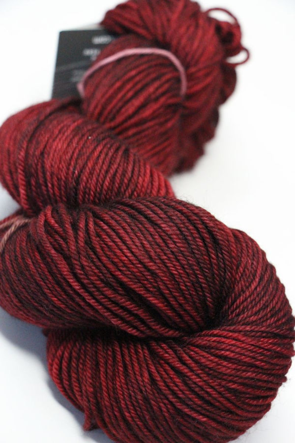 MadelineTosh Vintage Merino Wool Yarn in tart color, soft and textured skein for knitting or crochet projects.