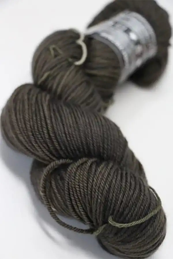 Madeline Tosh Vintage Merino Wool Yarn in Twig color, showing soft, textured skein of hand-dyed yarn for knitting or crocheting.