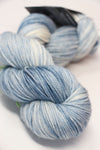 Cream-colored madelinetosh VINTAGE Merino Wool Yarn in whitewash shade, soft and textured for knitting or crochet projects.