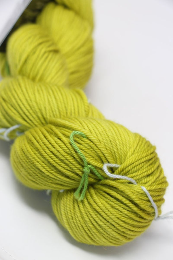MadelineTosh Vintage Merino Wool Yarn in Grasshopper color, soft and textured for knitting or crochet projects.