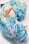 Madeline Tosh Vintage Merino Wool Yarn in a soft, multicolored skein, showcasing vibrant hues and rich texture.
