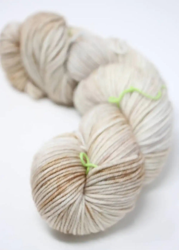 Madeline Tosh Vintage Merino Wool Yarn in natural color, showcasing soft, textured fibers ideal for knitting or crochet projects.