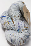 Madelinetosh Tosh DK yarn in Conference Call colorway, showcasing soft, chunky dyed wool yarn on a neutral background.