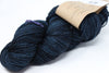 Soft, hand-dyed Madelinetosh Tosh DK yarn in Dubrovnik colorway, showcasing its rich, vibrant blue and purple tones.