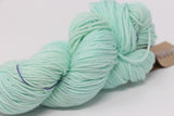 Madelinetosh Tosh DK yarn in Havana colorway, soft wool blend with rich, warm brown hues and subtle color variations.