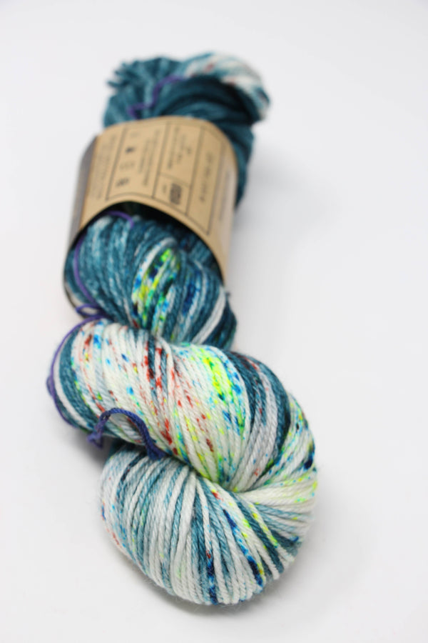 Madelinetosh Tosh DK yarn in Heart of Darkness color, soft wool-dyed DK weight yarn for knitting or crochet projects.