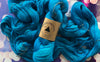 Madelinetosh Tosh DK yarn in Ocean colorway, showing soft, variegated wool yarn with subtle blue and green tones.
