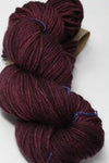 Madelinetosh Tosh DK yarn in Phantasm colorway, showing a close-up of soft, multicolored wool yarn for knitting or crochet projects.