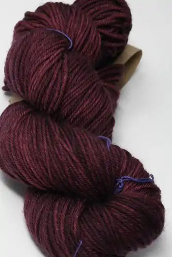 Madelinetosh Tosh DK yarn in Phantasm colorway, showing a close-up of soft, multicolored wool yarn for knitting or crochet projects.