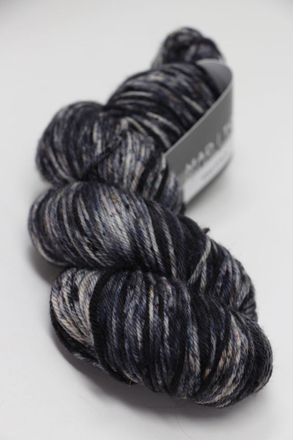 Madelinetosh Tosh DK yarn in the Void color, soft and versatile fingering weight wool blend for knitting and crochet projects.