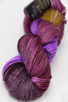 Madelinetosh Tosh DK yarn in Blind Love colorway, soft wool fiber, showcasing vibrant variegated blue and purple tones.