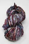 Malabrigo Rasta merino wool yarn in vibrant color, thick and soft, shown in a close-up of the yarn skein.