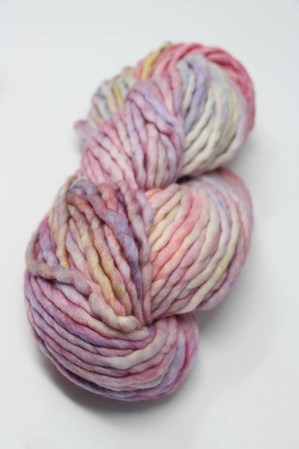 Malabrigo Rasta Merino Wool Yarn in Rosalinda color, showing vibrant, thick, and soft hand-dyed yarn for knitting or crocheting.