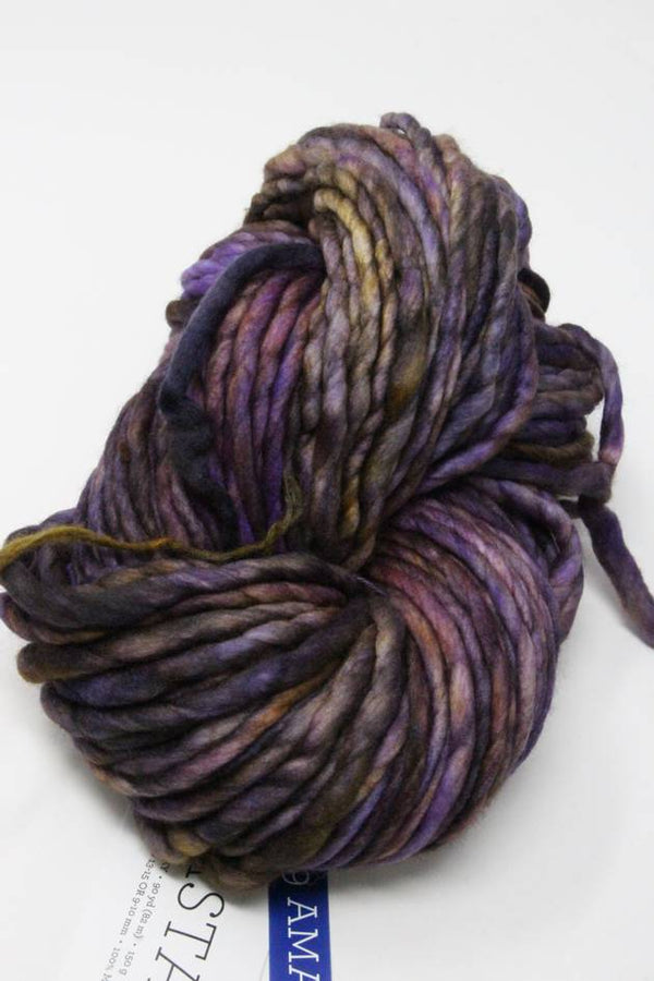 Malabrigo Rasta merino wool yarn in Amatista color, showing vibrant purple and blue hues, thick and soft texture.