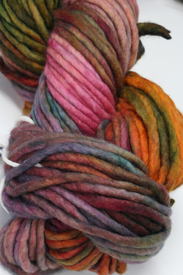 Bright multicolor Malabrigo Rasta merino wool yarn skein with vibrant, thick, and soft wool fibers for knitting or crochet projects.