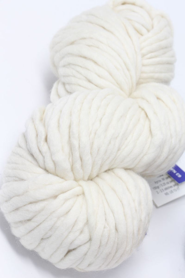 Natural Malabrigo Rasta merino wool yarn in natural color, soft and bulky with thick and thin textures.