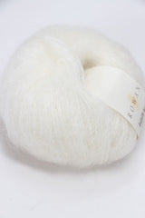 Cream-colored Rowan Kidsilk Haze yarn ball, soft and lightweight, suitable for knitting and crochet projects.
