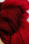 Close-up of Artyarns Merino Cloud Yarn in H Series, showcasing soft, fluffy merino wool fibers and vibrant color variations.