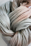 Close-up of Artyarns Merino Cloud Yarn in H Series, showing soft, lightweight wool fibers with a gentle, textured appearance.