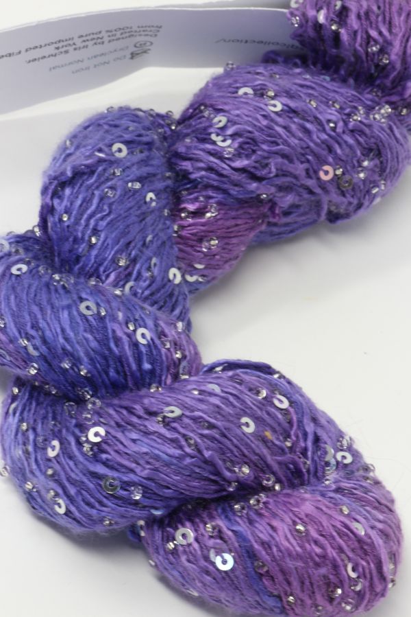 Beaded silk and sequins yarn by Artyarns from the Beaded Silk & Sequins Light series, showcasing shiny beads and delicate silk strands.