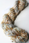 Beaded silk and sequins yarn from Artyarns' Beaded Silk & Sequins Light H Series, featuring shimmering beads and delicate texture.