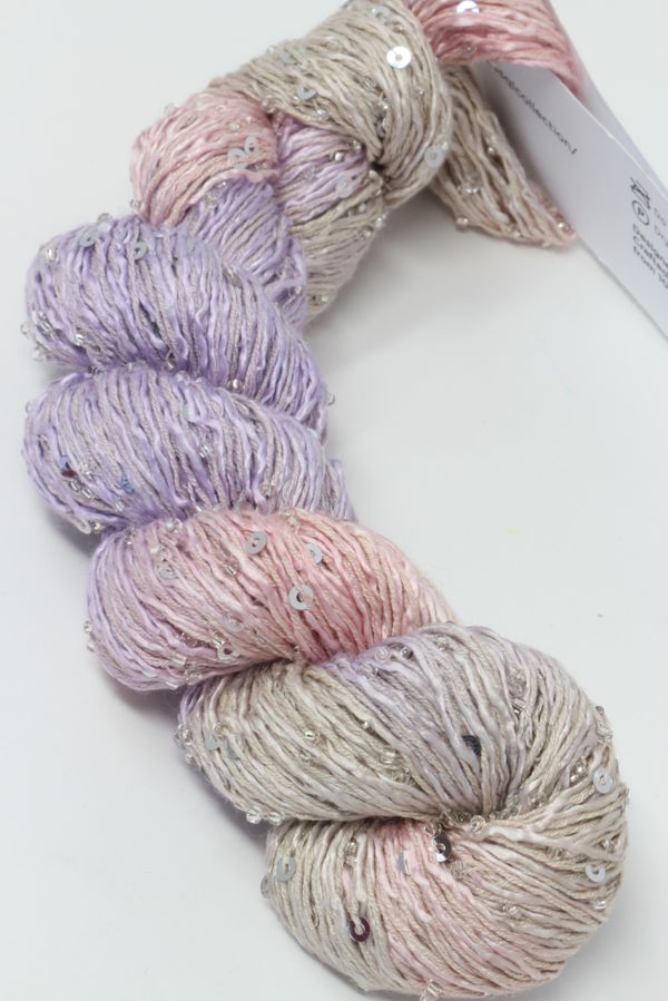 Beaded silk and sequins yarn by Artyarns from the Beaded Silk & Sequins Light series, showcasing shiny sequins and soft silk strands.