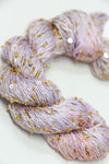 Beaded silk and sequins yarn from Artyarns' Artyarns Beaded Silk & Sequins Light H Series, featuring colorful beads and shimmering sequins.
