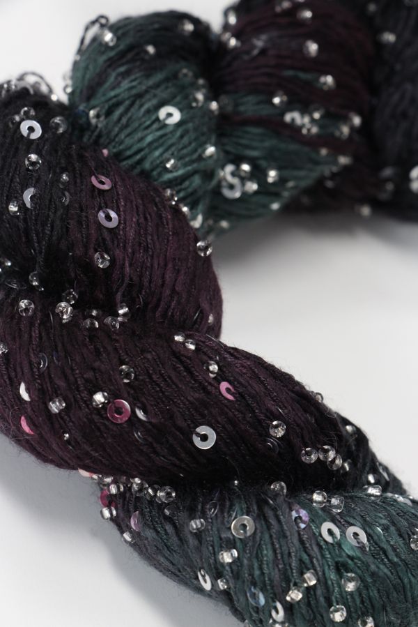 Beaded silk and sequins yarn from Artyarns' Beaded Silk & Sequins Light series, showcasing shiny beads and delicate fibers.