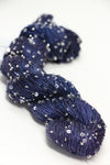 Beaded silk and sequins yarn by Artyarns from the Beaded Silk & Sequins Light series, showcasing a sparkly, textured fiber in a close-up view.