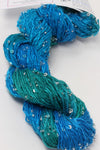 Beaded silk and sequins yarn from Artyarns' Beaded Silk & Sequins Light H Series in vibrant colors, showcasing intricate bead and sequin details.